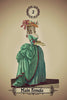 Illustration of a woman in an elaborate teal dress and floral hat holding a fan. The card, labeled 2 and Main Female, is from the Kipper Oracle Cards by Schiffer Publishing, Ltd., inspired by German divination cards.