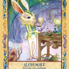 A white rabbit in a vest mixes potions at a glowing, whimsical table. Candles and swirling patterns fill the magical cave. Text reads, Secret Woods by Schiffer Publishing, Ltd.: Healing art cards for inspiration and an improved outlook.