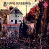A dark, cloaked figure stands before an old house amid leafless trees and overgrown vines, featured on the cover of "The Art of Metal" by Schiffer Publishing, Ltd.—a showcase of classic heavy metal album artwork.