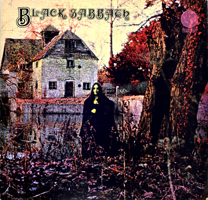 A dark, cloaked figure stands before an old house amid leafless trees and overgrown vines, featured on the cover of "The Art of Metal" by Schiffer Publishing, Ltd.—a showcase of classic heavy metal album artwork.