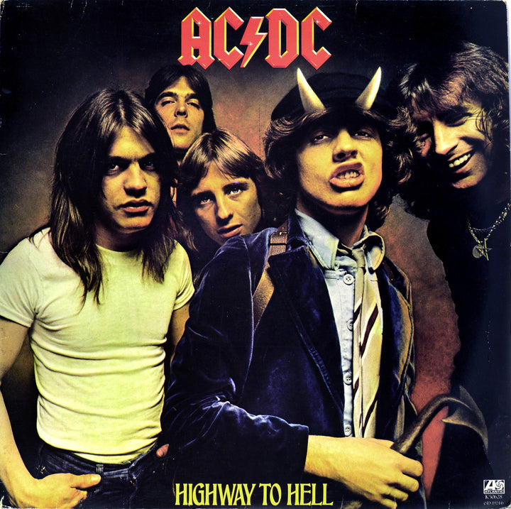 Five men pose on AC/DC’s “Highway to Hell” cover—one in a schoolboy outfit with devil horns. This iconic image is featured in *The Art of Metal* by Schiffer Publishing, Ltd., showcasing the genre's legendary album artwork.