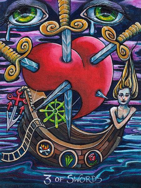 The Bonefire Tarot by Schiffer Publishing, Ltd. features an illustrated 3 of Swords card: a heart pierced by swords above a ship with mermaid figurehead, teary eyes in the sky, and a calm sea, inspired by Sailor Jerry tattoo art.
