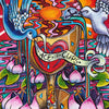 Vivid, hand-painted Ace of Cups from the Bonefire Tarot by Schiffer Publishing, Ltd., featuring a golden heart chalice, two birds pouring water, lotus flowers below, and radiant rays inspired by classic Sailor Jerry tattoo flash.
