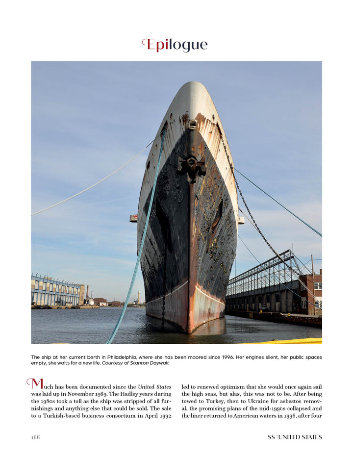 The SS United States, featured by Schiffer Publishing, Ltd., rests quietly at a Philadelphia pier, its weathered hull reflecting the storied ocean liner's past and its once record-breaking transatlantic legacy under a clear sky.