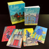 The Lisboa Tarot by Schiffer Publishing, Ltd. features five vibrant, Old World European-inspired cards with Lisbon landmarks, a colorful guidebook, and box—all shown in a playful art style.