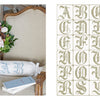 The Vintage French Needlework by Schiffer Publishing, Ltd. features an armchair with floral accents and a pillow adorned with ornate A and S monograms, beside a chart displaying decorative alphabet embroidery patterns from A–Z.