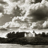The Maine Coast" by Schiffer Publishing, Ltd. showcases a white lighthouse and house on a rocky shore under a dramatic sky—black-and-white seascape photography capturing Maine's timeless beauty.