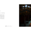 A person sits alone in a dimly lit church pew, illuminated by stained glass, reading Aramaic text and information about Bet-Resho and language revitalization in "On the National Language" by Schiffer Publishing, Ltd.