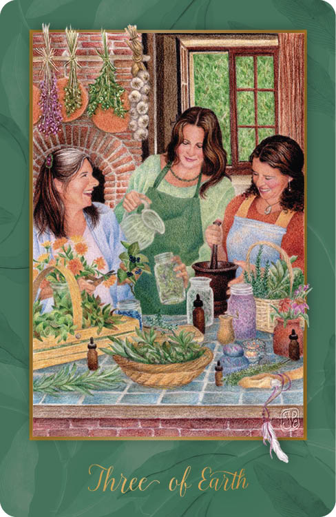 Three women joyfully make herbal remedies in a sunlit kitchen, surrounded by fresh herbs and jars. Smiling as they work, they radiate teamwork. Card: Three of Earth from the Gaian Tarot by Schiffer Publishing, Ltd.
