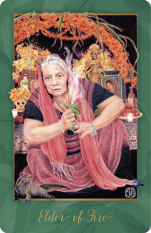 An older woman with gray hair and a pink shawl sits before an altar of marigolds, candles, skulls, and photos, holding a smoking bundle of herbs. "Elder of Fire" appears below. From Gaian Tarot by Schiffer Publishing, Ltd.