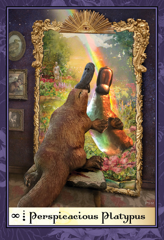 A platypus gazes into a golden mirror, seeing its reflection in a rainbow-lit garden. Framed in purple with "Boadicea's Tarot of Earthly Delights" by Schiffer Publishing, Ltd., it evokes the imaginative world of fine art tarot.