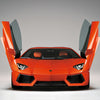 A front view of the Automobili Lamborghini Special Edition by Schiffer Publishing, Ltd. showcases its scissor doors open in a studio with a gray background—ideal for luxury sportscar and Automobili Lamborghini aficionados.