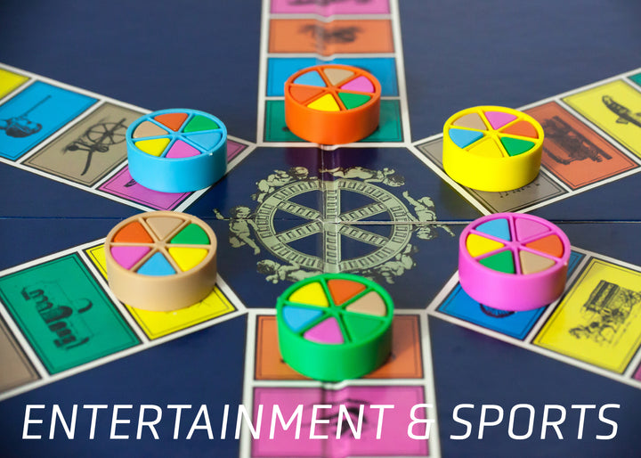 Colorful Trivial Pursuit pieces on a game board, each with unique wedges, rest among category spaces. Below reads "ENTERTAINMENT & SPORTS," highlighting Schiffer Publishing, Ltd.’s "Iconic Objects of the 1980s.