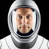 A person in a white and gray space helmet and suit, reminiscent of International Space Station photos, gazes at the camera—evoking the wonder found in Schiffer Publishing, Ltd.’s The Earth from Space Coloring Book.