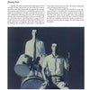 A man holding a trumpet stands beside another, their poses reflecting the vibrant energy featured in "Chinese Artists" by Schiffer Publishing, Ltd.