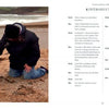 On a Devon beach, someone kneels by black Labrador Nell and a tennis ball, with waves and cliffs behind. The right side features "Conversations with Nell," a Schiffer Publishing, Ltd. dog adventure book with an interview-style intro.