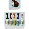 A white ceramic quail figurine sits above two rows of ten glossy The World of Wade Whimsies mini Betty Boop collectibles by Schiffer Publishing, Ltd., in assorted colors, displayed on a white background.