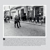 The Leibstandarte in Greece" by Schiffer Publishing, Ltd. features a black-and-white photo of a German soldier, likely from the Leibstandarte SS Adolf Hitler, leading troops through a Greek city street in 1941 as civilians look on.
