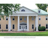 Chateau Country by Schiffer Publishing, Ltd. captures the timeless charm of Brandywine Valley du Pont estate homes—a light yellow, two-story building with a green metal roof, white columns, and a grand central entrance amid lush lawns and trees.