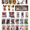 Star Wars Toys by Schiffer Publishing, Ltd. are on display in boxes, featuring Darth Vader, Yoda, Chewbacca, Stormtroopers, and Disney character bobbleheads like Mickey Mouse in various costumes.
