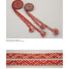 Norwegian Pick-Up Bandweaving by Schiffer Publishing, Ltd. features two woven red and white bands with geometric motifs: the top shows them rolled with fringed ends, while the bottom highlights traditional band weaving patterns up close.