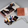 The Ghost Hunters' Tool Kit by Schiffer Publishing, Ltd. includes the box, instructions, metal dowsing rods and stakes for ghost investigations, plus laminated cards featuring photos of different locations.