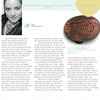 A magazine page displays a black-and-white portrait of a woman and an oval handcrafted brooch, with text revealing hidden jewelry details and design inspiration from "Behind the Brooch" by Schiffer Publishing, Ltd.