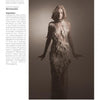 A woman models a long, sheer, feathered gown in a softly lit studio. Beside her, text highlights Olivia Grace Deeney and her womenswear designs, excerpted from Schiffer Publishing, Ltd.'s Europe: Rising Fashion Designers.
