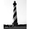 Ghosts of the Outer Banks" by Schiffer Publishing, Ltd. features a black and white photo of a lighthouse, evoking classic ghost stories and haunted legends from the coastal region.