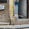 A close-up of a wall, highlighting textures and colors reminiscent of The Dogs of Cuba by Schiffer Publishing, Ltd., inspired by dogs roaming vibrant Cuban streets.