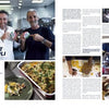 Two smiling men hold food containers in a kitchen. The left page displays a baked dish, while the right features cooking and wine as people prepare Rakott Krumpli, from The Athlete's Cookbook by Schiffer Publishing, Ltd.