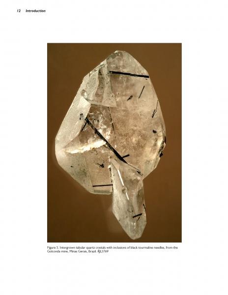 Featured against a simple brown background, the book "Collector's Guide to the Tourmaline Group" by Schiffer Publishing, Ltd. is a valuable resource for enthusiasts of quartz with black tourmaline inclusions from Colônia mine, Minas Gerais, Brazil.