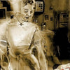 A sepia-toned image of a ghostly nurse stands in a hospital room. "Energy" appears at the top, and "1 ~ Magician" at the bottom, inspired by A Christmas Tarot from Schiffer Publishing, Ltd.