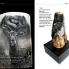 On the left is "Scrimshaw in Theory and Practice" by Schiffer Publishing, Ltd., open to an impala and mammoth ivory eye sketch; on the right, a carved mammoth tooth with a falcon’s face stands vertically on a pedestal.