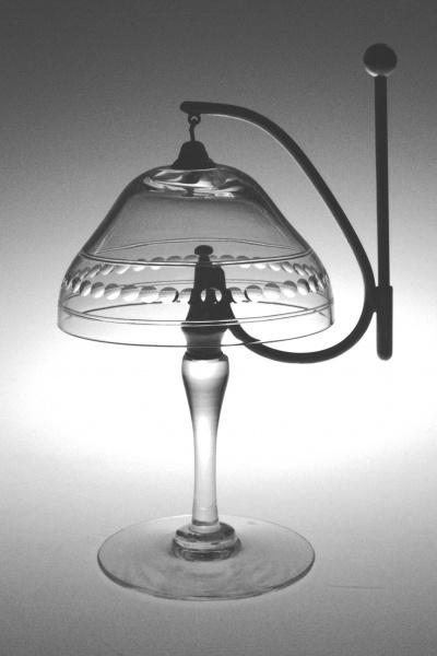 The “American Glass Bells” by Schiffer Publishing, Ltd. showcases exquisite glass craftsmanship—rounded, patterned shades rest on stemmed bases, making this elegant collection perfect for any glass enthusiast or collector.
