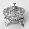 The book "American Glass Bells" by Schiffer Publishing, Ltd. is perfect for glass enthusiasts and collectors, offering detailed insights and images of decorative glass bells, ideal as a display piece on any plain surface.