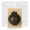 Showcased on a white surface, "Mata Ortiz Pottery Today" by Schiffer Publishing, Ltd. is placed next to a striking black polished pot with thick engravings and a squared rim by artist Sigred Juárez Quezada (9 ⅜" h x 9" d).