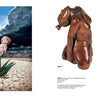 A surreal image from "Icons & Symbols of the Borderland" by Schiffer Publishing, Ltd.: a baby emerges from a green plant on cracked earth, beside two bent wooden human sculptures—a visual echo of US-Mexico border art.