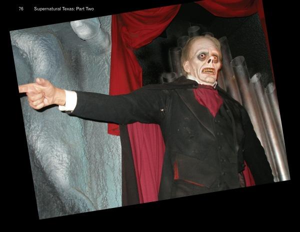 A life-sized mannequin dressed in black and red points eerily, evoking the haunted themes of "Supernatural Texas" by Schiffer Publishing, Ltd., with red curtains and large pipes enhancing the chilling, investigative atmosphere.