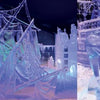 At the ice festival, blue and purple lights highlight Schiffer Publishing, Ltd.'s "Contemporary Ice Sculpture": a shipwreck with sails and rigging on the left, and a woman with flowing hair on part of a ship on the right.