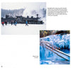 A scene from Durango Perspectives by Schiffer Publishing, Ltd. shows a steam train passing through snowy tracks as people play nearby, with a creek and icicles below, all framed by the winter beauty of the San Juan range.