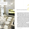 A modern interior with spherical chandeliers brightens a dining space in Reims, France. "Branding + Interior Design" by Schiffer Publishing, Ltd. shares Kelly Hoppen’s value insights—ideal for interior design firms and home goods brands.
