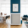 A modern living and dining room with light wood floors, blue accent walls, and minimalist decor—perfect for a Schöner Wohnen contest entry—featured in "Home Story" by Schiffer Publishing, Ltd.