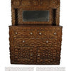 A Legacy in Tramp Art by Schiffer Publishing, Ltd. showcases a wooden sideboard with geometric tramp art carvings, glass knobs, multiple drawers, a mirrored top, and decorative backboard—highlighting folk art patterns and textured woodwork.