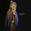 A person in vibrant traditional Tibetan attire holds a white bowl against a dark backdrop in "Ladakh" by Schiffer Publishing, Ltd.; beside them appears the text Guru Tso Kias Dorjay.