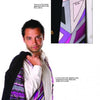 A man with short dark hair drapes a suit jacket over his shoulder, revealing vibrant Signature Prints by Schiffer Publishing, Ltd., with a matching tie in purple, gray, and black. An inset highlights the iconic print and label.