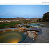 Find luxurious backyard inspiration in "New Ideas for Living Outdoors" by Schiffer Publishing, Ltd.—explore designs with circular spas, pools, and hardscapes set against scenic hills and sunset views.