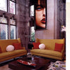 Inspired by Showhouses 1 from Schiffer Publishing, Ltd.: envision a stylish living room with tall stained glass windows, mustard-yellow sofas, and a dark wood coffee table—a perfect scene for historic home and design enthusiasts.