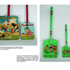 Comic Character Metal Sand Toys by Schiffer Publishing, Ltd.—two colorful vintage metal shovels with wooden handles: one tan with Donald Duck collectibles, the other green with Three Little Pigs, both featuring bright painted stripes.