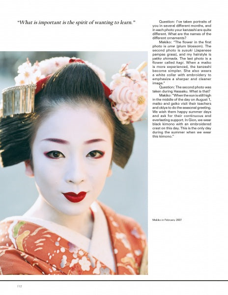 A Kyoto geisha in traditional attire and elaborate hair ornaments looks calmly at the camera. She wears white face makeup, red lips, and a red kimono. Text and an interview appear on the right. From "Geisha & Maiko of Kyoto" by Schiffer Publishing, Ltd.
